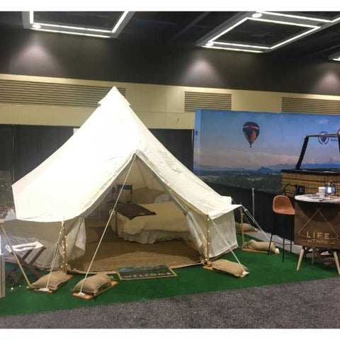 bell tent setup indoors at tradeshow