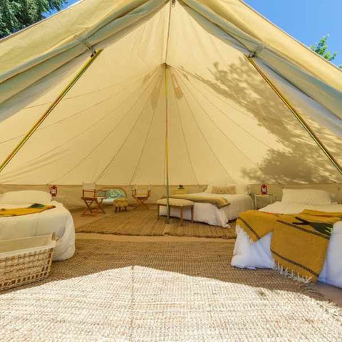 8-person canvas tent with queen bed and 2 cots