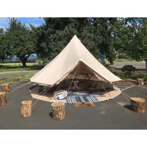 logs for bell tent setup on concrete