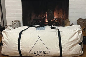 tent duffle bag in front of fireplace