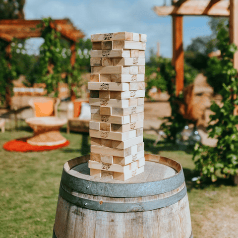 jenga game on barrel camping glamping